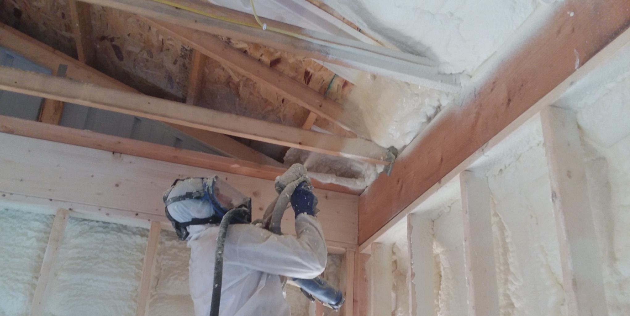 Accurate-Airtight Exteriors Crew Member Applying Spray Foam Insulation Accurate-Airtight Exteriors Crew Member Applying Spray Foam Insulation