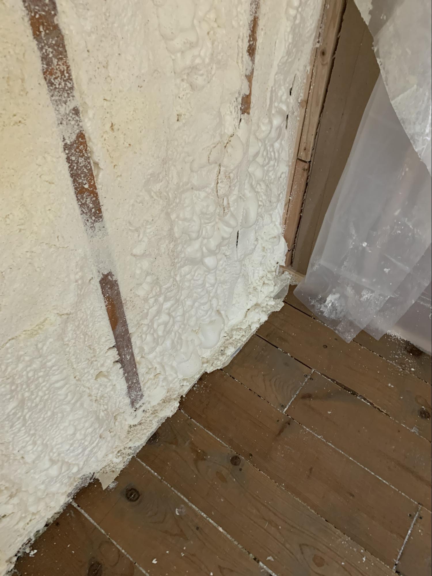 Spray foam insulation applied to basement wall cavities 