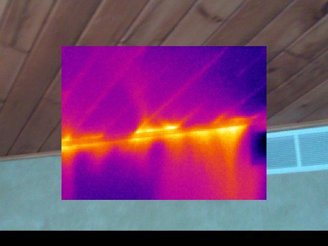 Infrared image where the ceiling and wall meet with a vent