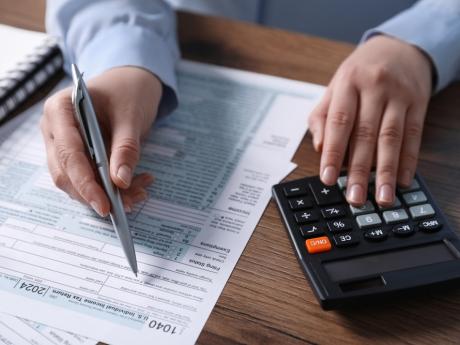 Person filing taxes at desk