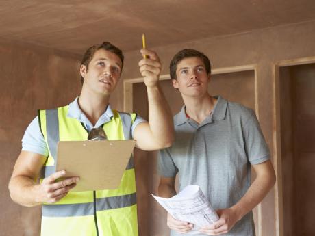 Contractor and homeowner going over checklist