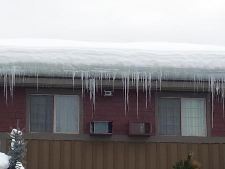 Ice Dam On House In Winter