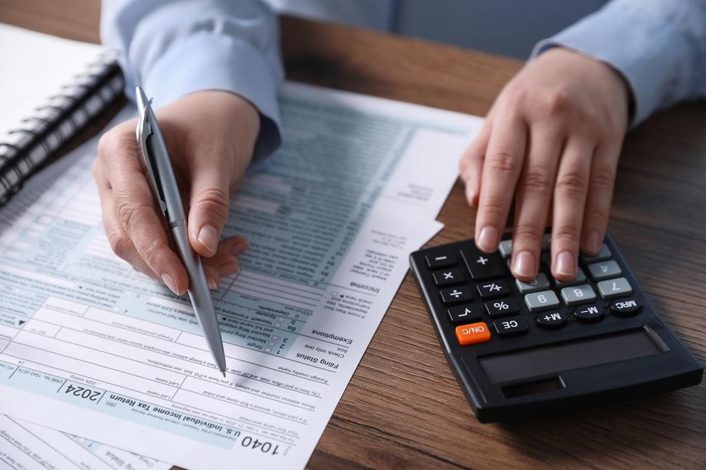 Person filing taxes at desk