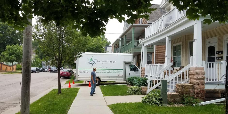 Accurate-Airtight Vehicle outside of house on the job