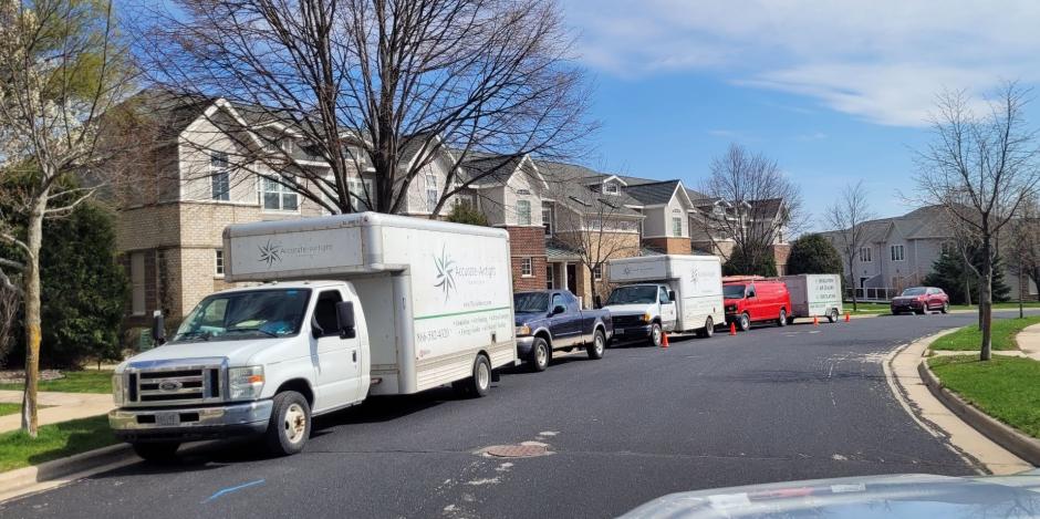 Accurate-Airtight Trucks Parked In Front Of Madison Condo For Insulation Removal Project