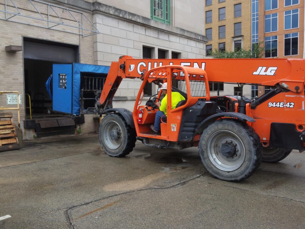 Forklift used in setup of G54 blower door.