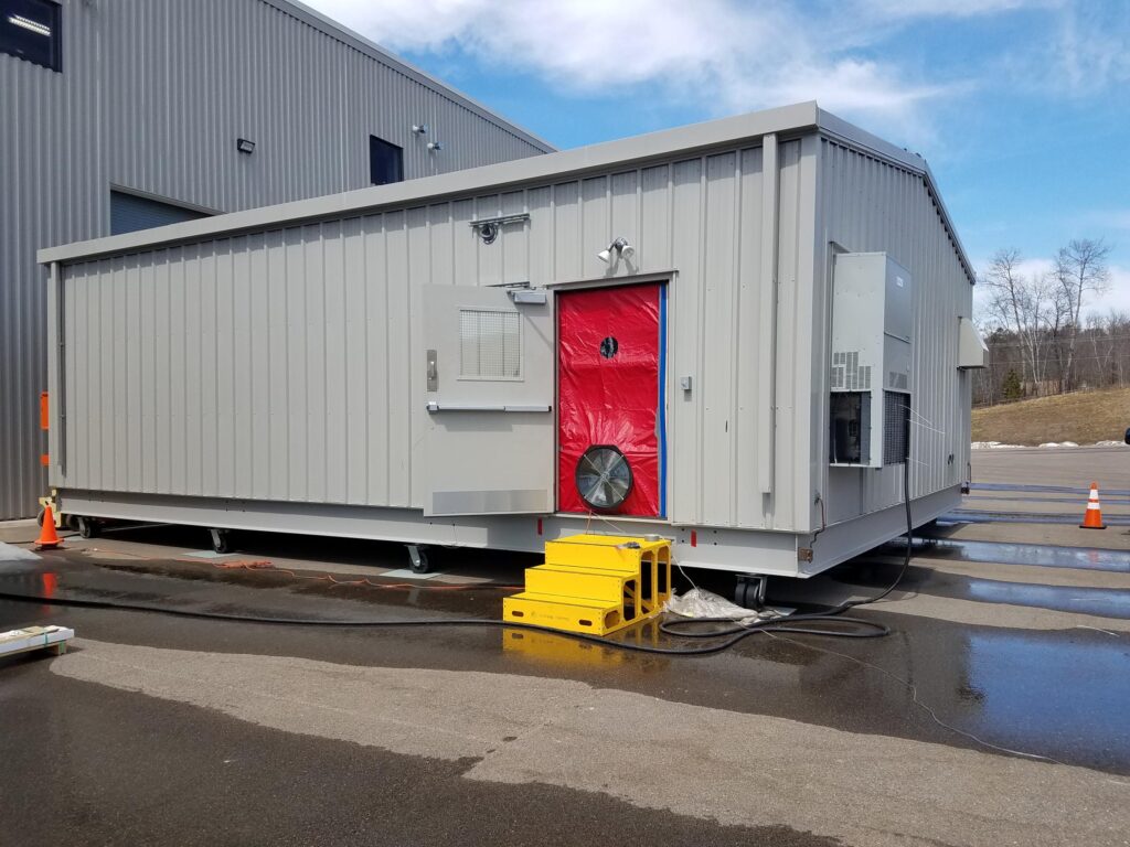 Air barrier testing of E-House is done to meet energy code requirements and as part of the QC process.