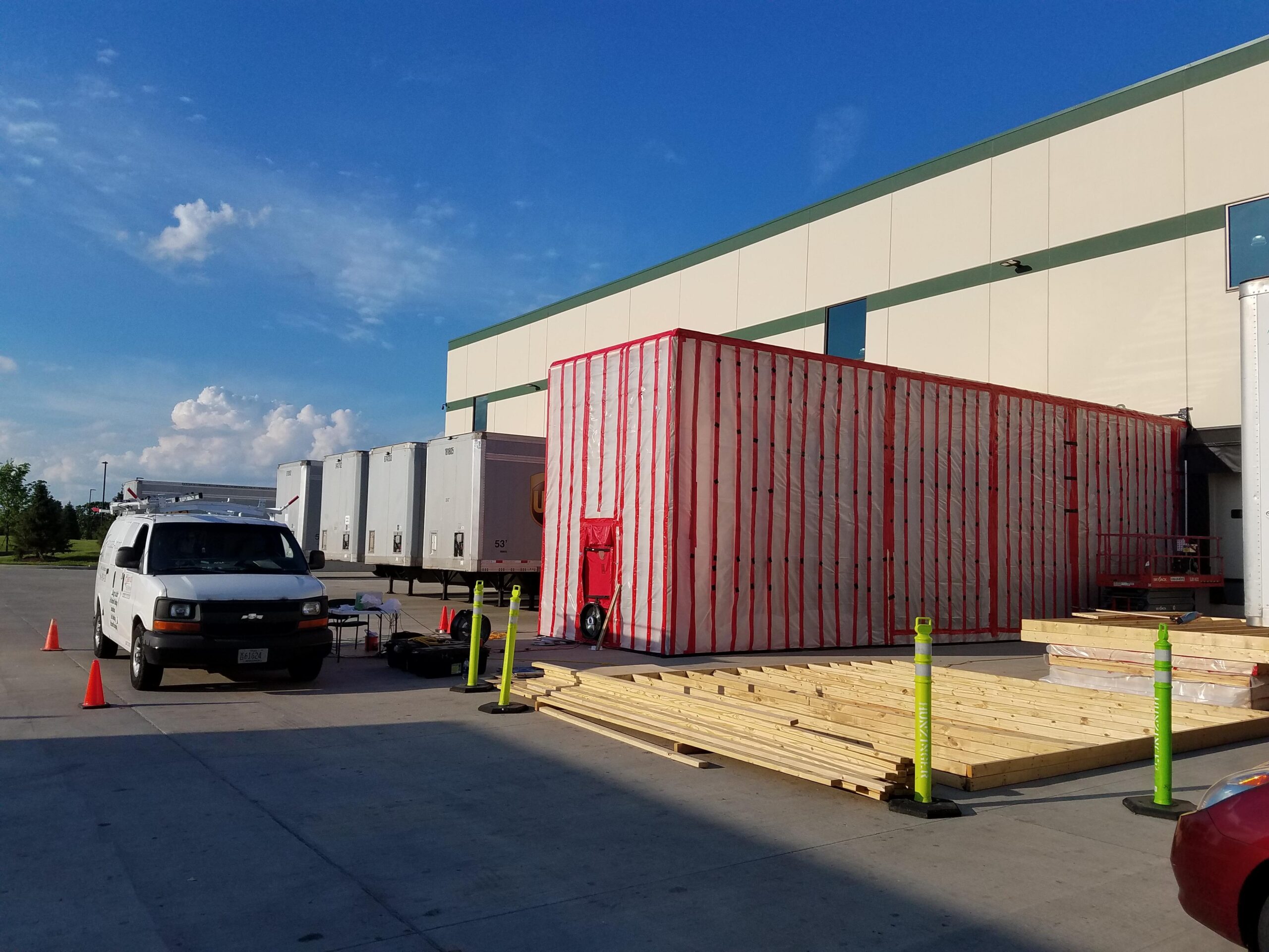 A-AE conducting a strategic test of dock door closures with a semi-trailer in place at the bumpers.