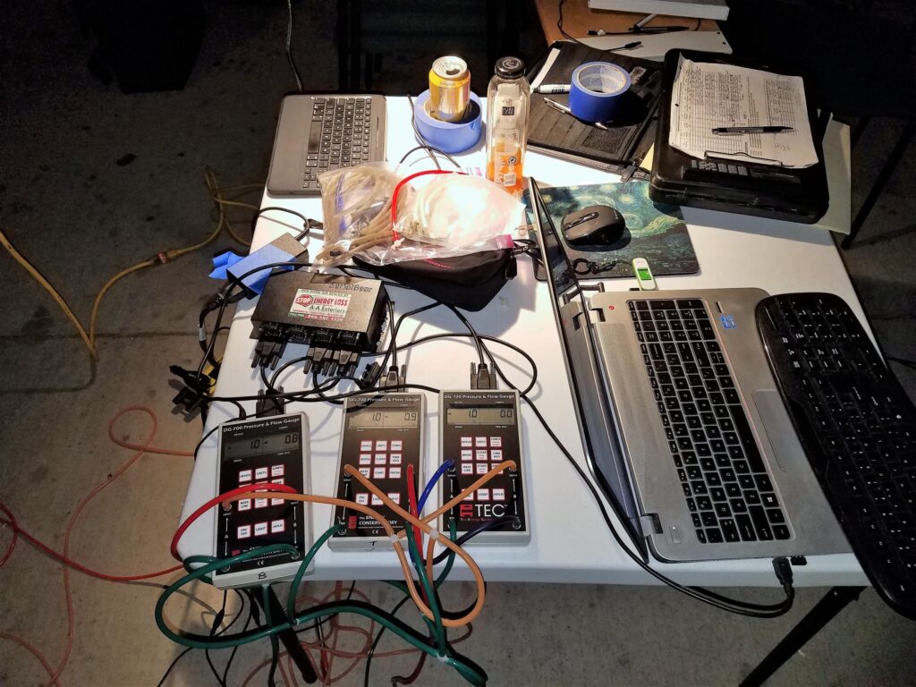 Multiple digital pressure gauges connected to a laptop may be used to record data during an air barrier test.