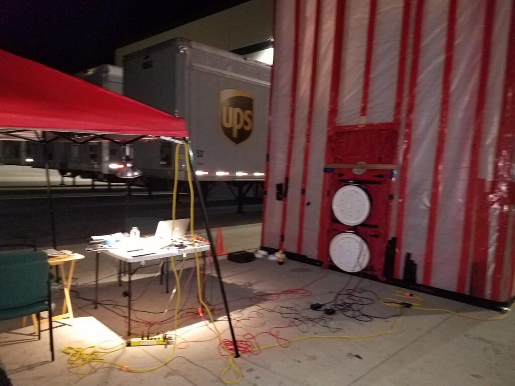 Blower door equipment and table used as workstation during air barrier testing.