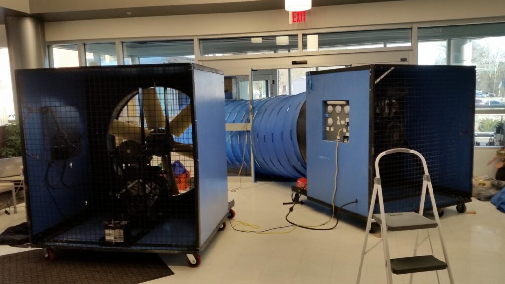To test large buildings with a lot of volume, multiple blower door fans and types may be used.