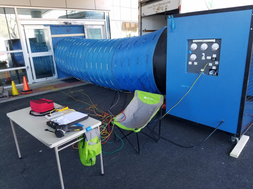 G54 blower door system and table used as a workstation during testing.