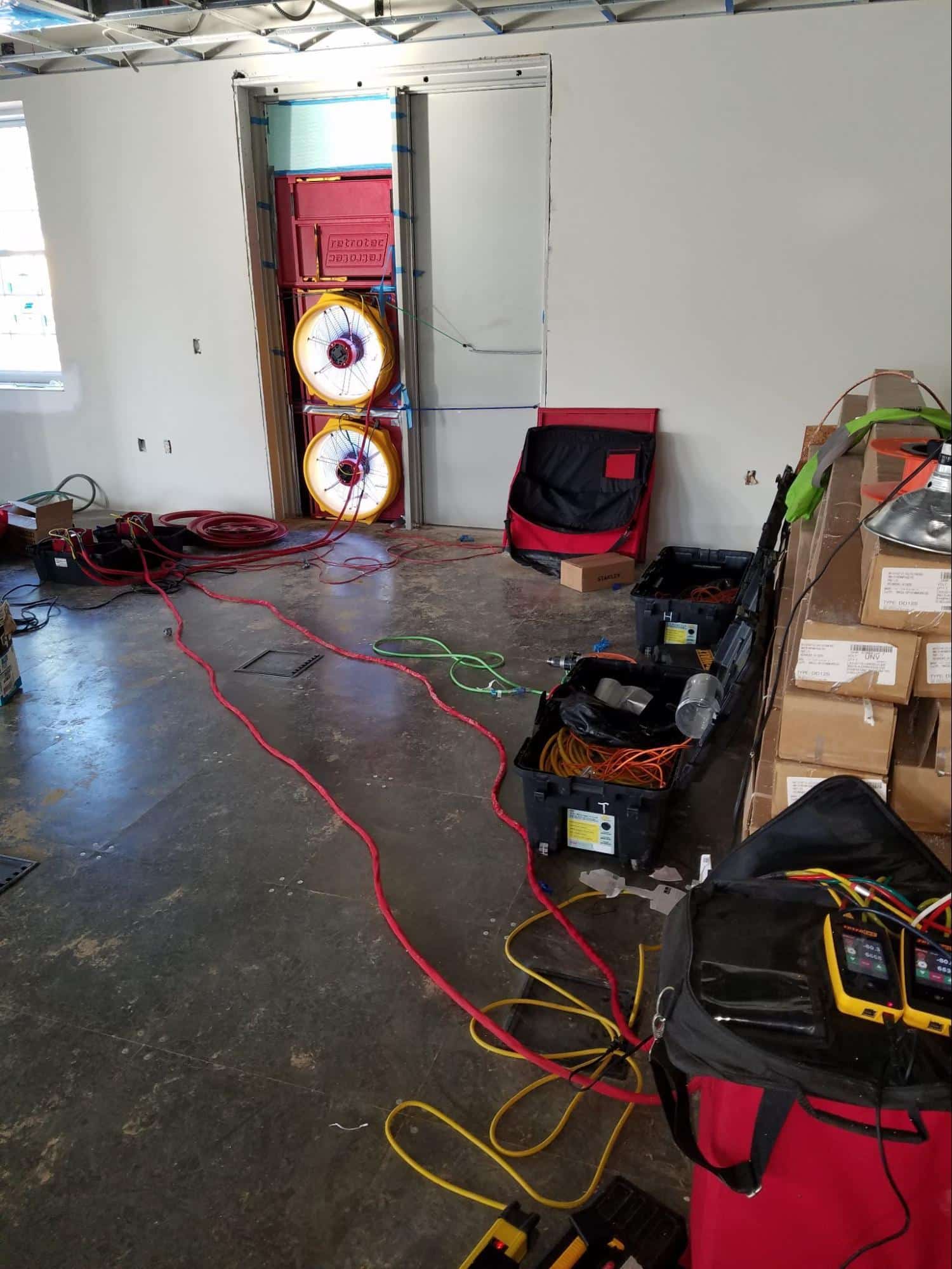 Commercial building blower door test in progress