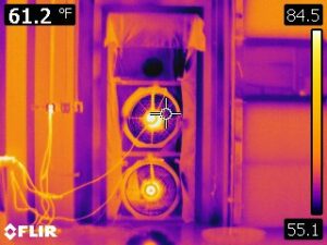 Infrared camera image of multiple blower door fans in an exterior door.