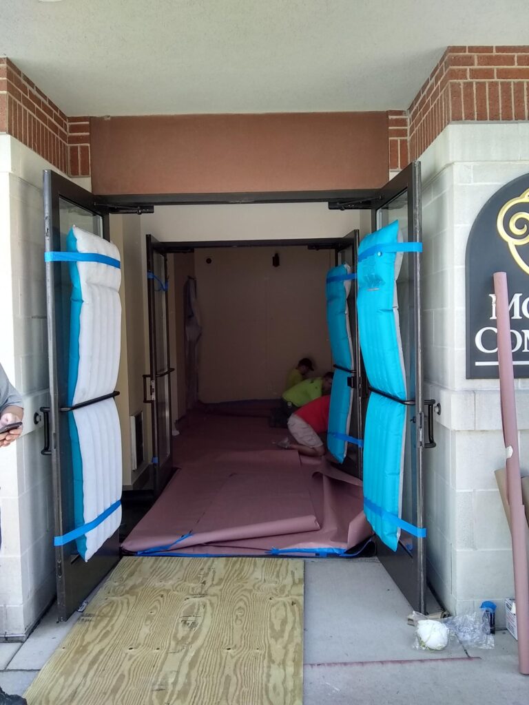 Prepping a commercial building for a blower door test.