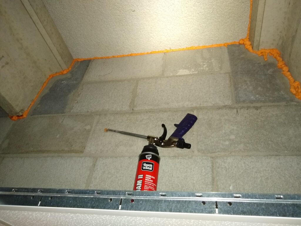 One-part spray foam used to seal air leak at wall/ceiling junction.