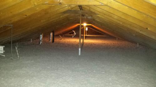 ATTIC OF A MULTIFAMILY BUILDING- INSULATED TO R50 WITH CELLULOSE