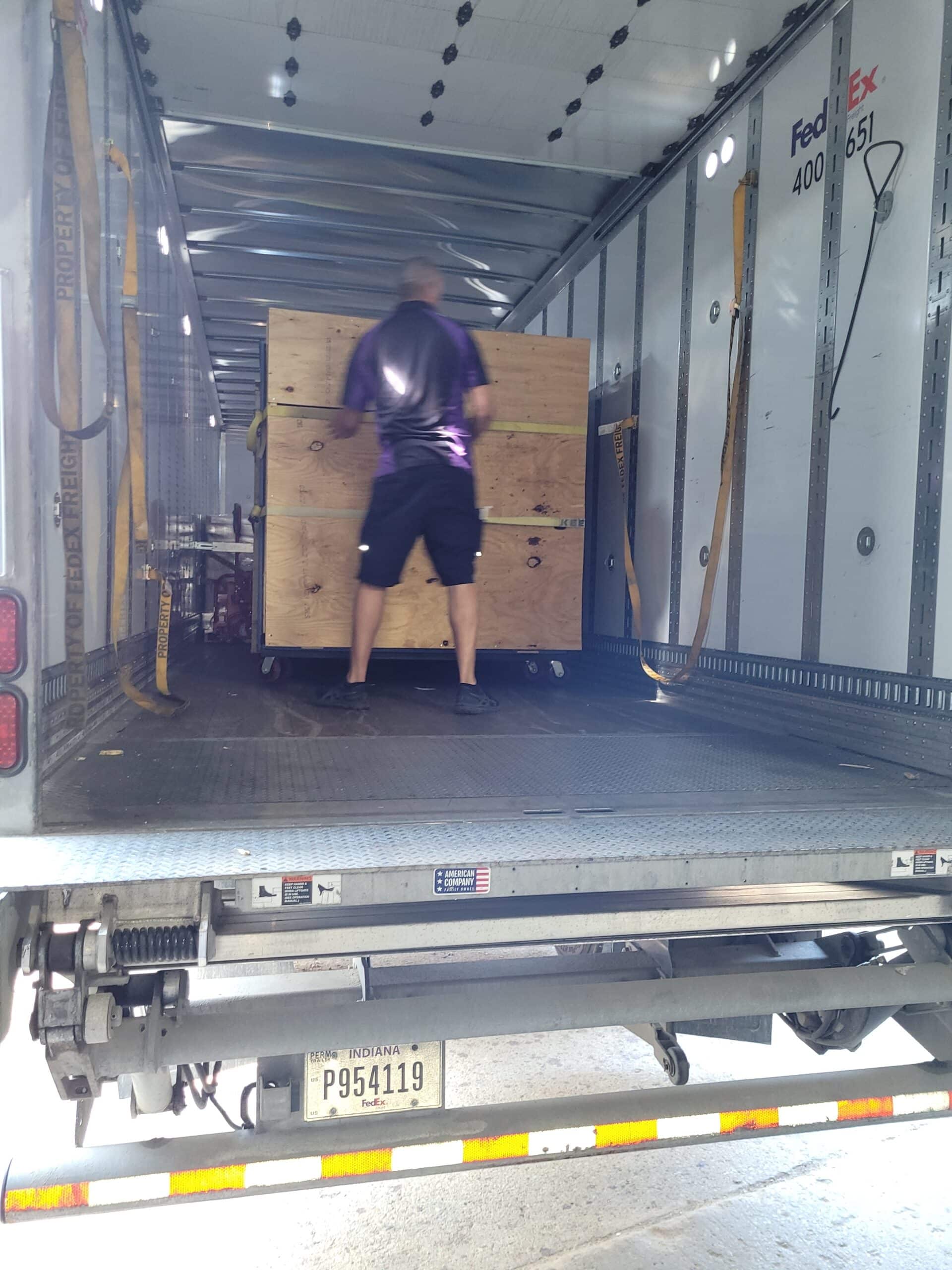 Packaged up blower door rental being loaded into truck