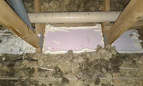 Close Up Of Caulk On Chimney In Attic