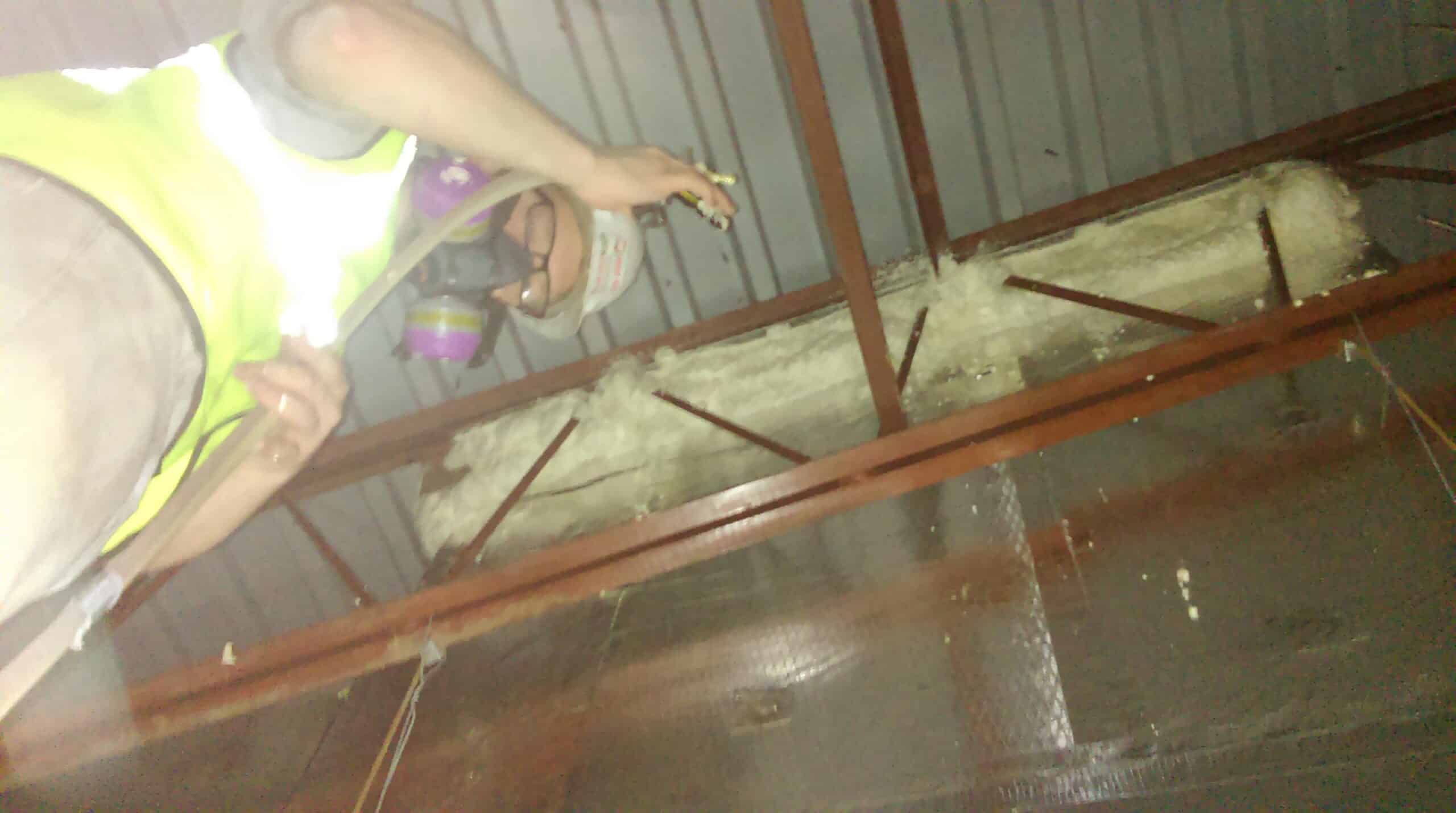 A-AE Team Working In Rafters Of School