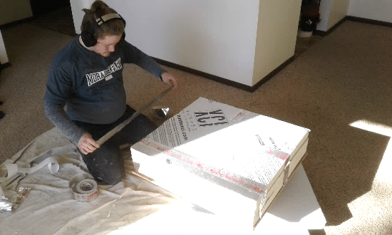 Worker Measuring Insulation