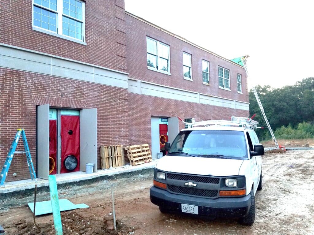 Blower door testing a US military building (Quantico) for air barrier compliance.
