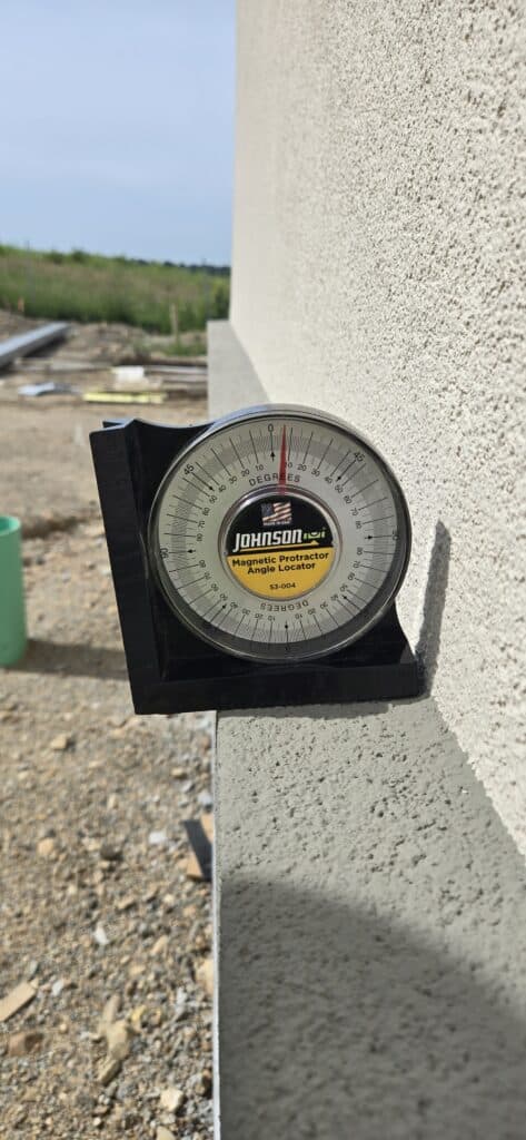 Ensuring slope of sill to EIFS during building envelope commissioning.