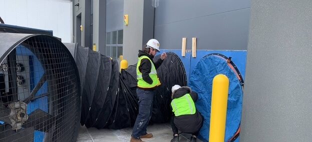 Accurate-Airtight Enclosures Team Setting-Up Commercial Blower Door In Building