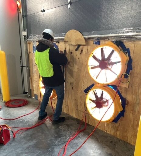 Technician working on blower door test