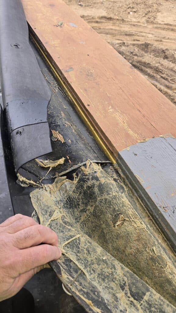 Closeup inspection of the air barrier of a building.