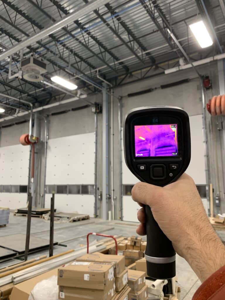 Checking loading dock doors with an infrared camera.