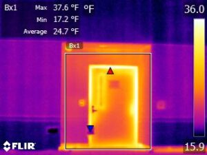 Cold weather infrared camera image showing heat transfer through exterior door.