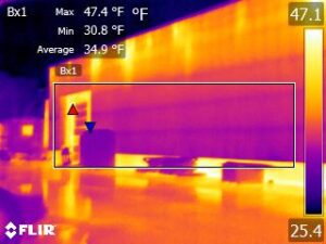 Infrared camera image of a commercial building in cold weather conditions.