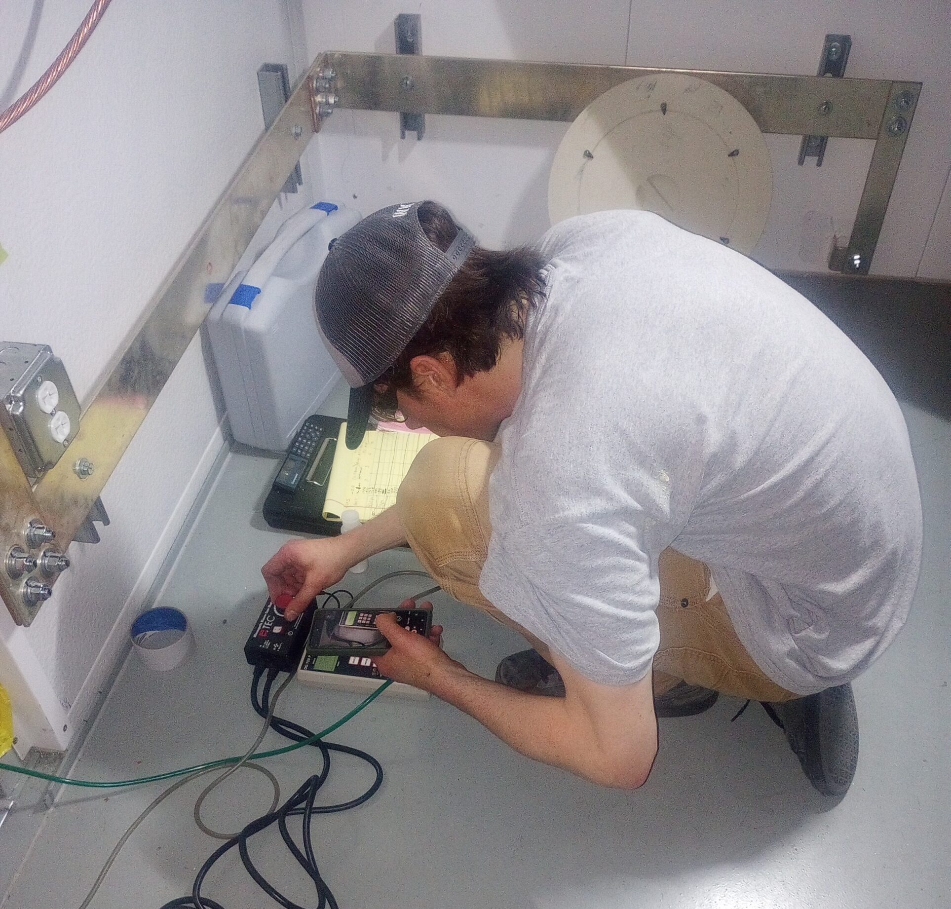 Accurate-Airtight Enclosures Team Calibrating Testing Equipment