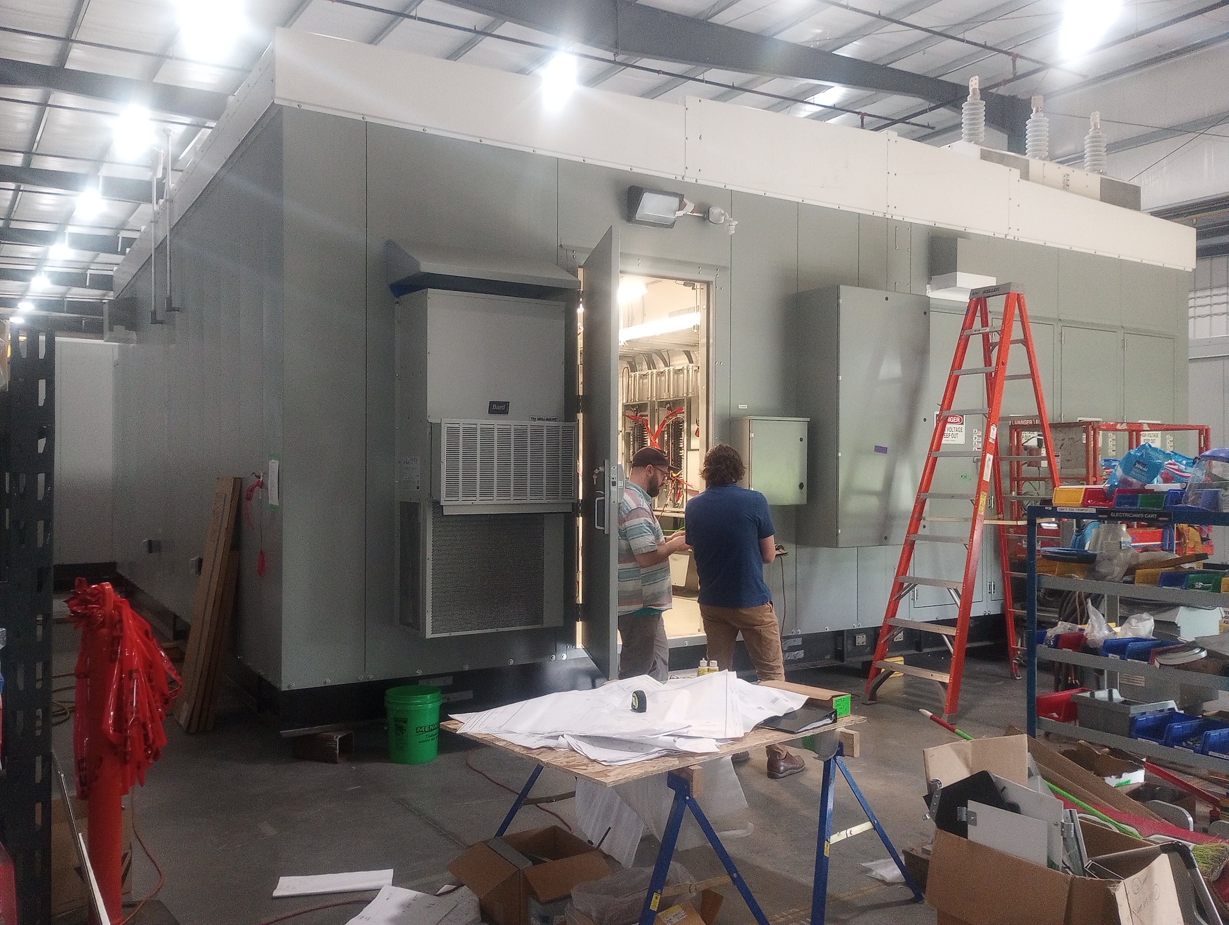 Team setting-up equipment at E-House job site